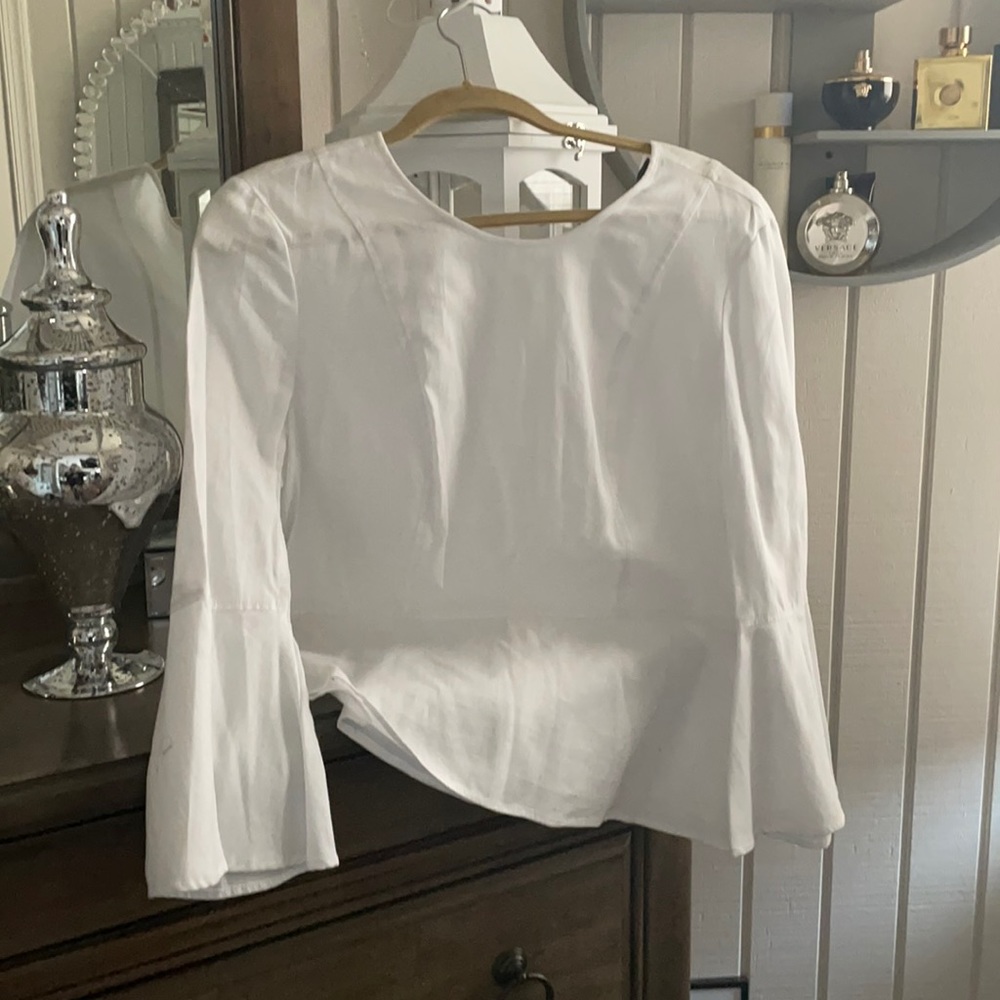 Brand new BCBG Maxazria white peplum top! Gorgeous